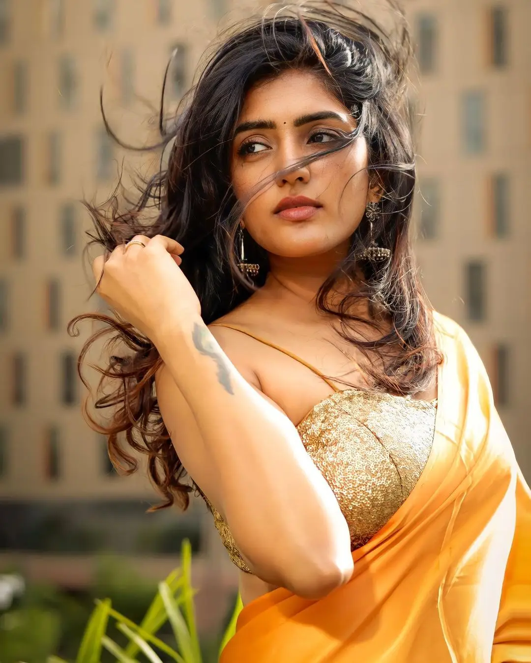 Eesha Rebba Charming Stills In Orange Saree Sleeveless Blouse